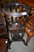 A 19th Century mahogany wash or wig stand, having drawers to undertier, turned column support and