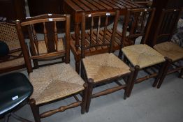 A set of four North Country Vernacular spindle back chairs having rush seats