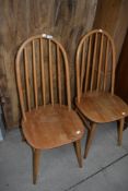 A pair of Ercol style hoop and stick back kitchen chairs