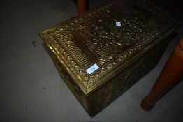 A brass slipper/kindling box