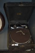 An early wind up record player or gramophone by HMV