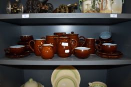 A selection of tea wares by Denby in brown and blue glazes