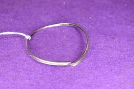 A narrow silver bangle marked 925 being sold for the shoebox appeal charity