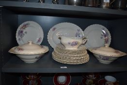 A part dinner service by J and G Meakin in a floral pattern