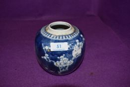 A Chinese ginger jar hard paste having traditional blue and white decoration with matching shade