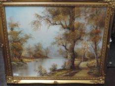 An oil painting, IC, lake and woodland, indistinctly signed, 50 x 60cm, plus frame and glazed