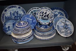 A large collection of blue and white wear plates including Royal Copenhagen and similar