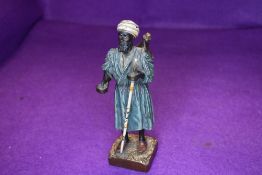 An antique bronze figure of a middle eastern tradesman cold painted stamped for Franz Bergman in