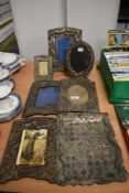 A selection of early 20th century Japanese pewter photo and picture frames embossed with mythical