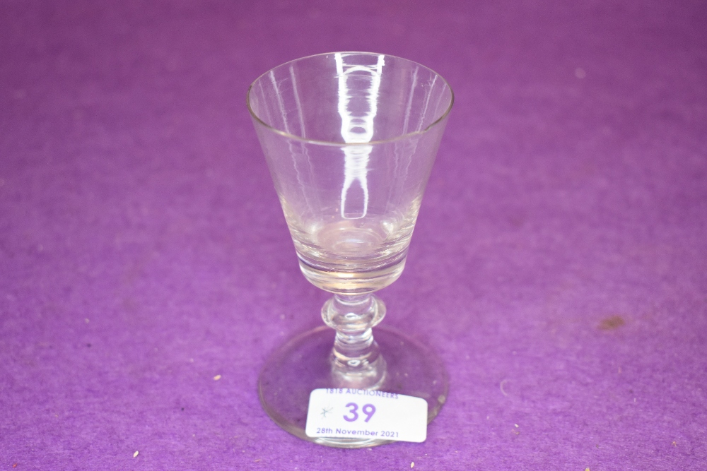 A small Victorian wine glass with central knop to stem.