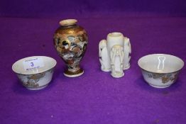 A bud vase or pot carved with the three wise monkeys, two pinch pots with extensive gilt detailing