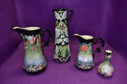 Four pieces of Old Tupton ware having green and blue ground with floral design.