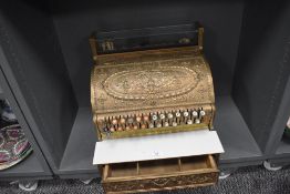 An Edwardian shop keepers till with ornate brass case