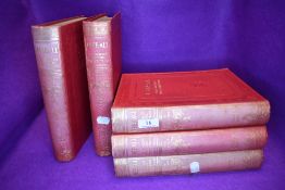 Five vintage encyclopaedia volumes.