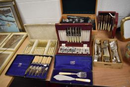 A selection of cutlery and flatware including boxed examples