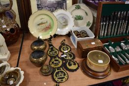 A selection of hardware including fish design plates and copper items