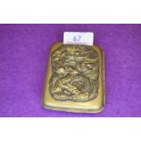 A Japanese cigarette or card case having embossed dragon motif and makers mark to reverse