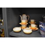 An art deco part coffee set by Grays Pottery in an orange and yellow banded pattern