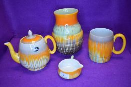 A collection of Shelley Harmony drip ware in the orange colour way, original Paper label still in