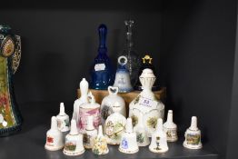 A selection of miniature ceramic and glass ringers and hand bells