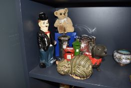 A selection of ceramic and metal money box and piggy banks