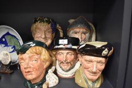 A selection of Royal Doulton character jugs and mugs including Monty and Dick Whittington