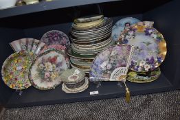 A selection of ceramic display and similar plates including ceramic fans