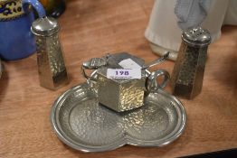 A pewter cruet set by Craftsman