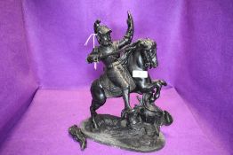 A late Victorian metal spelter figure study of a medieval knight on horse back in a battle stance.