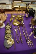 A selection of brass wares including pairs of candle sticks and fire side items