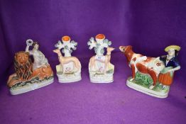 A selection of Staffordshire flat back figures and pair of spill vase