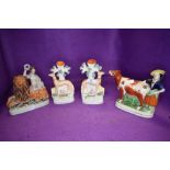 A selection of Staffordshire flat back figures and pair of spill vase