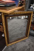 A mirror with gilt and gesso frame work