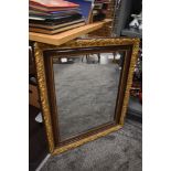 A mirror with gilt and gesso frame work