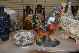 A Chinese decorated bowl and a similar porcelain figure of a rooster