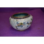 A small squat cloisonne bowl with flower decoration