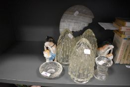 Three glass light shades a pair of porcelian dog figures and a stone cut decoration