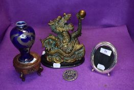 A mixed lot of items including oriental blue vase with dragon on wooden stand, figurine, brooch