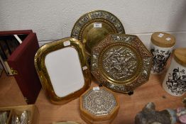 Two Indian silver decorated embossed plates and a similar trinket jewellery case and sterling