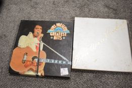 Two vinyl record box sets for Elvis Presley