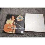 Two vinyl record box sets for Elvis Presley