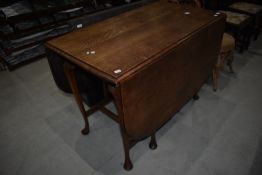 A traditional oak gateleg table having interesting frame being on cabriole legs , width approx.