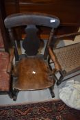 A 19t Century stained frame child's rocking chair having vase back