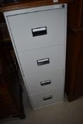 A modern metal four drawer filing cabinet
