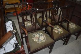 A set of six (four plus two) mahogany dining chairs in a Hepplewhite/Chippendale style having drop