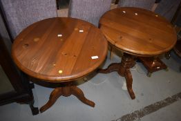 A pair of modern pine occasional table having circular tops and triple splay legs, diameter each