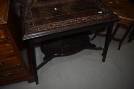 A Victorian part oak side table having carved top and shaped undertier, width approx. 81cm
