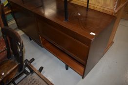 A vintage sapele sideboard (office or living) having tambour doors, width approx 153cm