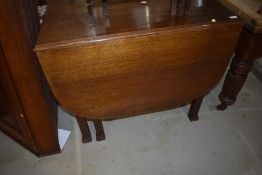 A mid 20th Century oak gateleg dining table