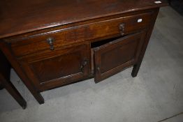 An early 20th Century bathroom or similar cabinet having long drawer and double cupboard under,